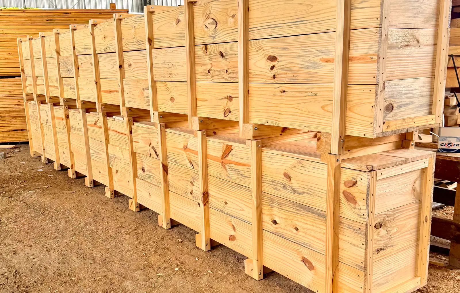 A row of industrial timber crates produced by A. Tavares
